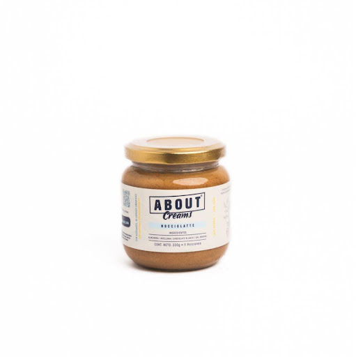 Crema Nocciolatte  ABOUT Envase de vidrio x 1 und Crema untable Nocciolatte: almendra y avellana con chocolate blanco sin azúcar. Natural, ultra cremosa y elaborada con ingredientes reales. Endulzada con alulosa y eritritol, sin azúcares ni grasas añ