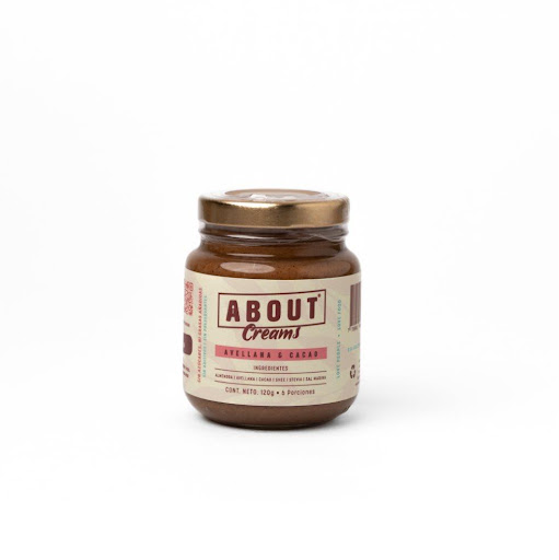 Crema Avellana & cacao 120g ABOUT Envase de vidrio x 1 Crema untable de avellana, almendra y cacao, 100% natural. Textura suave, sabor intenso y chocolatoso, hecha solo con ingredientes naturales. Sin aceites añadidos, sin azúcares añadidos ni aditivos ar